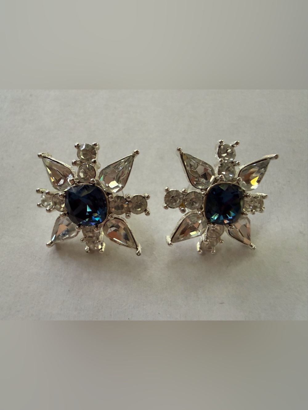 Napier pierced Silver Starburst Stud Earrings with Deep Blue Center